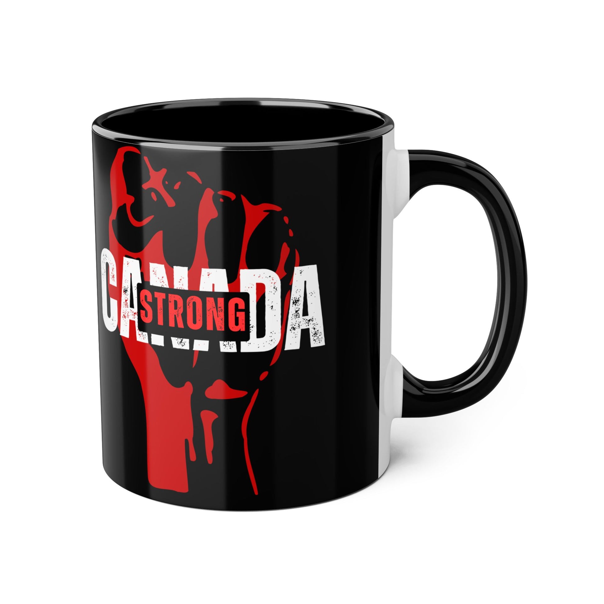 A black ceramic mug with a graphic maple leaf and the text 'CANADA STRONG' on it, with red accent colors.
